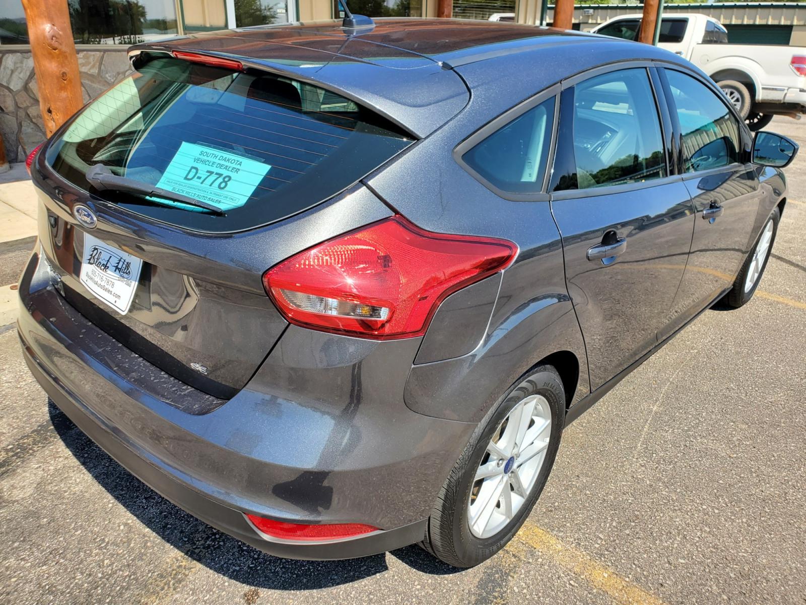 2016 Tan /Black Ford Focus SE (1FADP3F23GL) with an 2.0L 4Cyl GDI TI-VCT engine, 6-Speed Powershift Automatic transmission, located at 1600 E Hwy 44, Rapid City, SD, 57703, (605) 716-7878, 44.070232, -103.171410 - Photo #34